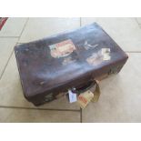 A good quality vintage leather suitcase by Army and Navy Cooperative with interesting Cunard line