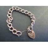 A 9ct rose gold bracelet, chain link with heart shaped clasp - approx weight 11.9 grams - one link