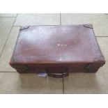 A Vintage leather suitcase with brass locks - 18cm x 66cm x 41cm - generally good condition, wear