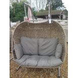 A Bramblecrest Oakridge all weather wicker double hanging cocoon