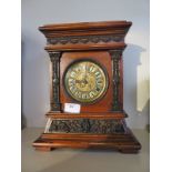 A small oak case mantle clock, brass dial - 29cm tall