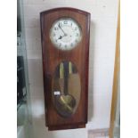 A mahogany case eight day weight driven wall clock, strikes hours and half hours on rod, oval
