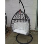 A Garden Egg Chair with cushions in as new condition