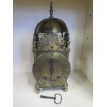 A brass lantern clock with a later added french strike movement by A D Mougin, Paris - with a brocot