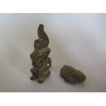 Two stone figures of man and frog, with holes in back for cords, 8cm and 4cm long both generally