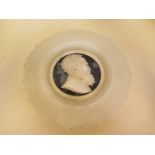 A carved marble portrait plate 25cm diameter, reasonably good, minor chipping flaking to glass back