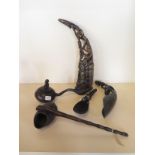 A collection of five carved curious to include a lombok horn carving 33cm tall and four scoops