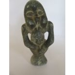 A carved stone figure, 19cm tall, no obvious damage or repair