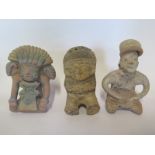 A Pre-Columbian or later seated figurine with hunch back and three suspension holes in hat, 13cm