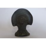 A pre-Columbian or later black ware head of a figure with head-dress, 10cm tall with damage to