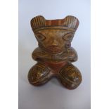 A Pre-Columbian or later seated polychrome figure Ocarina/whistle, 12cm tall, overall sound