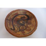A restored Pre-Columbian or later dragon decorated dish, 16cm diameter