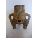 A Pre-Columbian or later Costa Rica: A polychrome jaguar vessel standing on tripod legs bearing