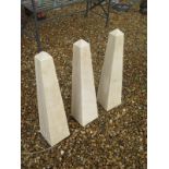 A set of three limestone obelisks 60cm tall