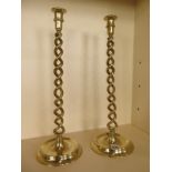 A pair of brass open twist candle sticks 51cm tall, good clean condition