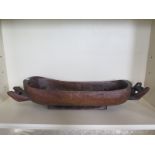 A carved hardwood trough with two handles, plug, and linear decoration, 20cm tall x 93cm long x 24cm