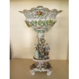 A German porcelain centrepiece probably late 19th Century with figures and floral encrusted