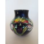 An A W Moorcroft vase, 12cm tall, overall crazing small firing fault to rim, otherwise reasonably