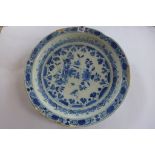 A Delft blue and white dish, 30c, Diameter with chips and loses to rim and old repairs