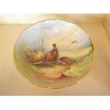 A Minton bowl with pheasant decoration, signed L Woodhouse - 8cm tall x 29cm wide - in very good