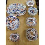 A 19th Century Imari palette part dinner service to include a large tureen, three other tureens, a