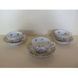 Three Meissen cups and saucers with bird and foliage decoration, saucers 6cm diameter, all generally