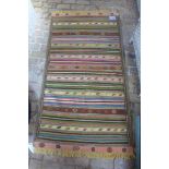 A hand knotted woollen Kilim rug - 1.82m x 1.02m