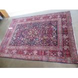 A hand knotted woollen Tabriz rug - 1.91m x 1.4m