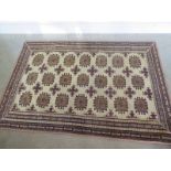 A hand knotted woollen Baluchi rug - 1.7m x 1.15m
