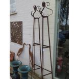 A pair of hand forged wrought iron triangular garden obelisks with scrolled finials - 229cm H x 23cm