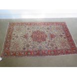 A hand knotted woollen Tabriz rug - 1.65m x 1m