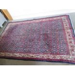 A hand knotted woollen Malayer rug - 2.42m x 1.55m