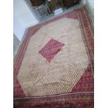 A hand knotted woollen Araak rug - size 4.30m x 3.22m