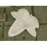 A hand-carved limestone ivy leaf garden ornament, 64cm wide