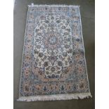 A hand knotted woollen Nain rug - 1.93m x 1.15m