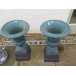 A pair of antique cast iron garden urns on stands - 66cm H x 36cm Diameter