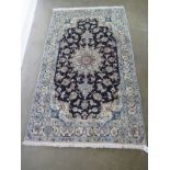 A hand knotted woollen fine Nain, silk inlaid rug - 2.04m x 1.2m