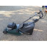 A Hayter Harrier 48 petrol lawn mower in working order with the owners manual