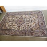 A hand knotted woollen Kashan rug - 2.08m x 1.45m