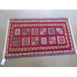 A hand knotted woollen Sozani rug - 1.17m x 0.72m