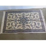 A hand knotted woollen Fine Nain rug - 1.45m x 0.91m