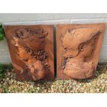 A pair of renaissance style terracotta garden wall plaques - 46cm H x 29cm W