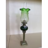 A pipe oil lamp with green etched glass shade and green glass font, 49cm tall, small chips to base