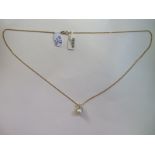 A 9ct yellow gold pearl and single diamond pendant on 9ct yellow gold chain, 44cm long, pearl approx