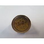 A full sovereign dated 1911 in a hallmarked 9ct gold ring mount - approx total weight 21.5 grams -