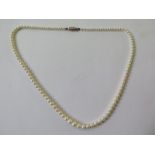 A string of graduating pearls, 50cm long with a 14ct gold clasp, largest pearl approx 6mm