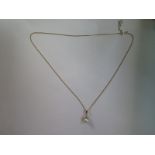 A 9ct yellow gold pearl pendant on a 9ct chain, 44cm long, pearl approx 6mm diameter - approx 2.6