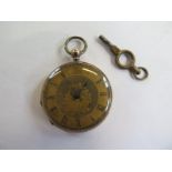 A 14ct gold pocket watch with base metal dust cover 36mm diameter with key - running in saleroom,