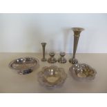 Three silver dishes, approx 11.2 troy oz, a pair of weighted silver dwarf candlesticks and two