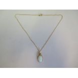 a hallmarked 9ct yellow gold opal pendant on a 40cm chain, approx 4.2 grams, new condition, ex